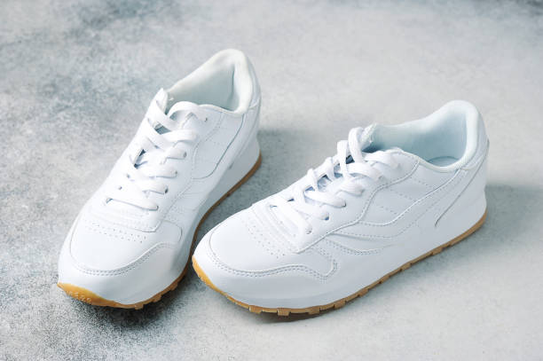 istock pair of white athletic sneakers 1214412975