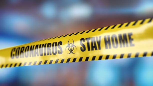 istock Coronavirus yellow tape with information Stay home 1214413856