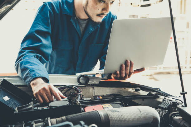 istock Professional mechanic providing car repair service 1214415402