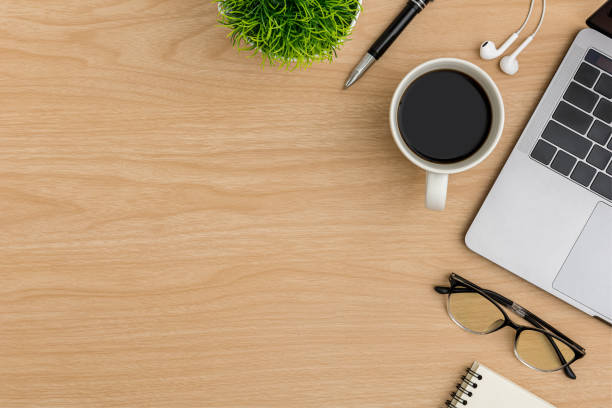 istock Top view Wood office desk table. Flat lay Workspace 1214415491