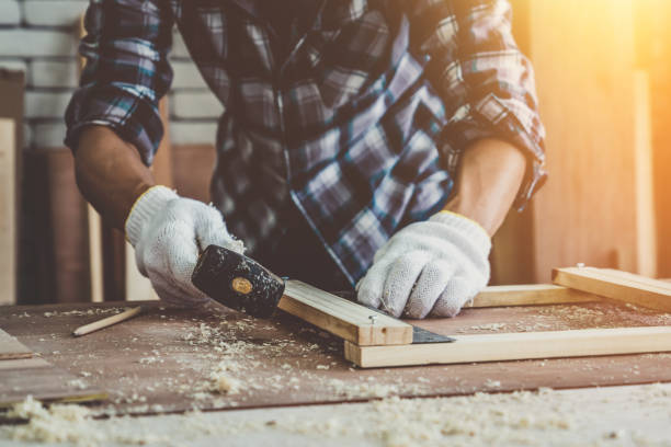 istock Carpenter working on wood craft at workshop 1214415493