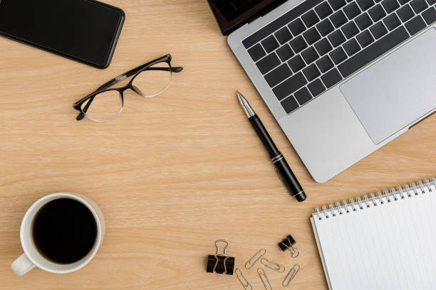 istock Top view Wood office desk table. Flat lay Workspace 1214415560