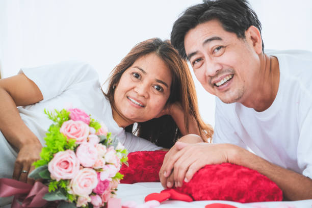 istock Happy Asian senior people having good time at home 1214416419