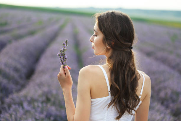 istock Young girl in lavender field 1214417447
