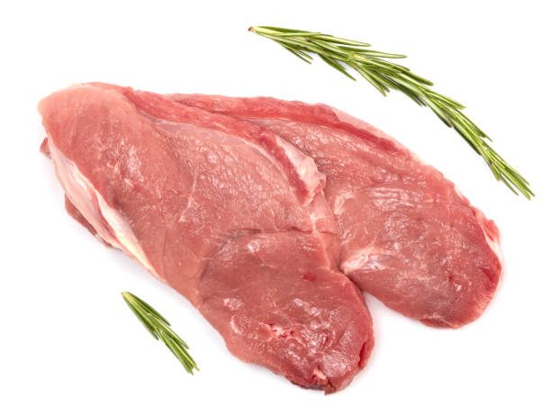 istock Sliced raw pork meat with rosemary isolated on white background 1214418411