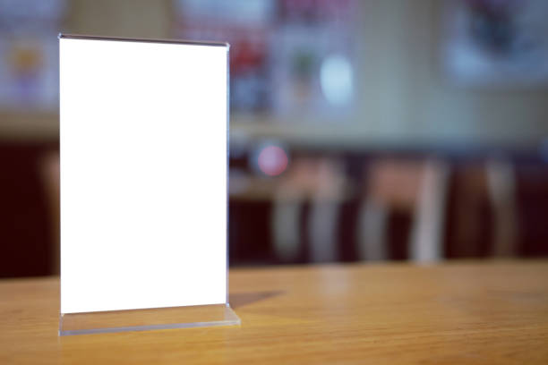 istock Mock up Menu frame standing on wood table in Bar restaurant cafe. space for text 1214418615