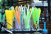 Plastic drinking vivid straws in the restaurant bar.