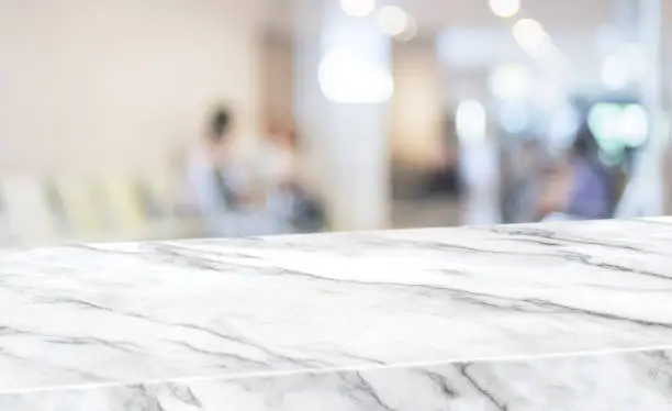 Healthty background.Empty diagonal white marble table with blur patient in hospital for treat virus blur background,banner mockup template for display of product