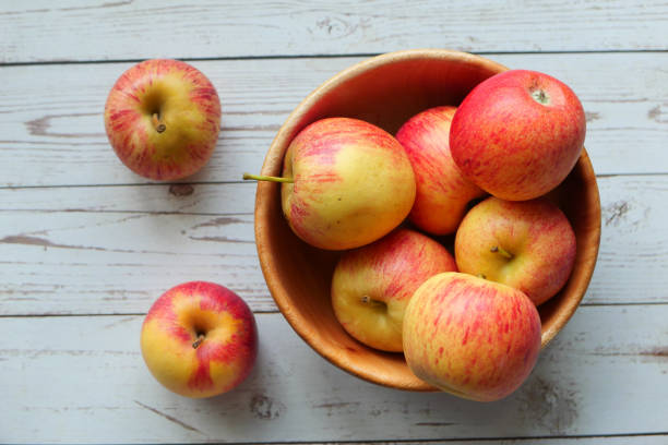 istock top view of red apple in a bowl on table 1214421019