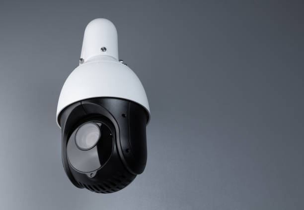 istock surveillance cctv camera video security with space on gray background. cctv camera banner. 1214423425