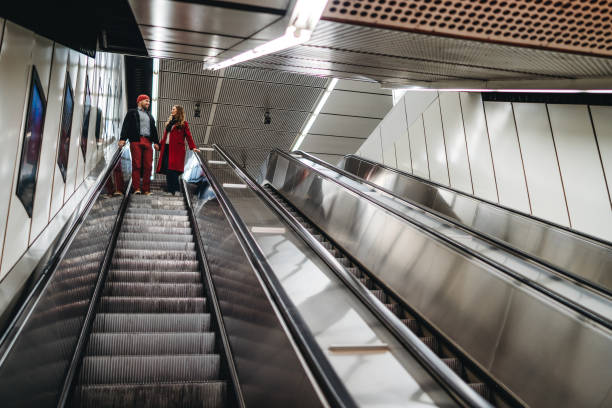 istock Couple in love on subway escalator 1214423527