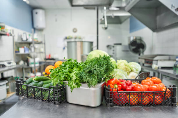 istock Fresh colorful Vegetables and fruit in kitchen on silver steel table. Work surface and kitchen equipment in professional kitchen. 1214429083