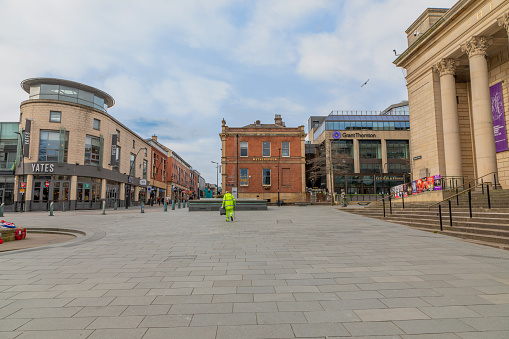 Sheffield, UK - March 21, 2020: Unusually quiet streets of Sheffield on a Saturday.  The day after the British Government ordered the closure of pubs, gyms and restaurants in order to fight the Coronavirus COVID-19 Outbreak.