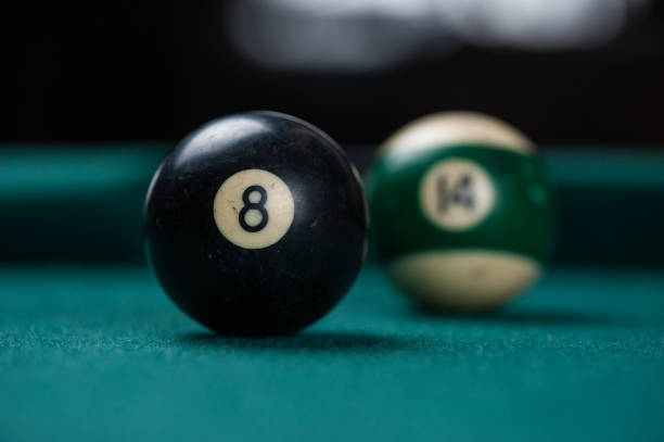 istock Billiards balls and cue on billiards table. Billiard sport concept. 1214429462