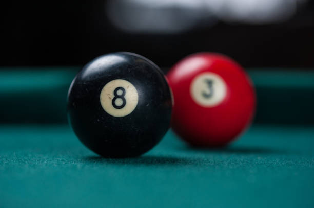 istock Billiards balls and cue on billiards table. Billiard sport concept. 1214429576