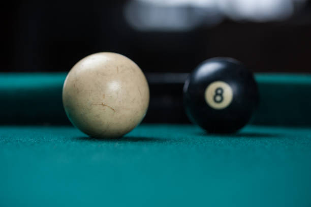 istock Billiards balls and cue on billiards table. Billiard sport concept. 1214429622