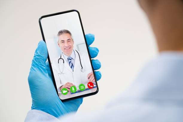 istock Man On Coronavirus Quarantine Calling Doctor 1214429650