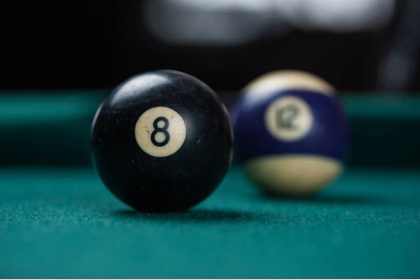 istock Billiards balls and cue on billiards table. Billiard sport concept. 1214429663