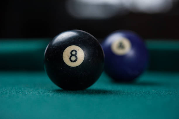 istock Billiards balls and cue on billiards table. Billiard sport concept. 1214429816