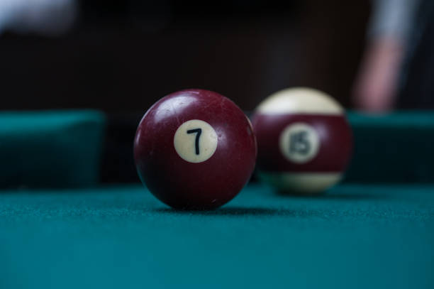 istock Billiards balls and cue on billiards table. Billiard sport concept. 1214429842