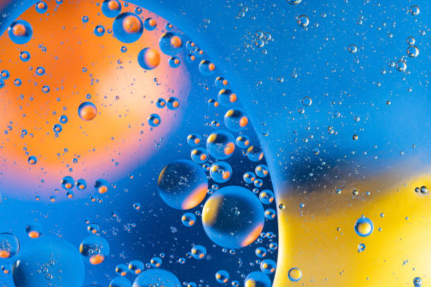 istock Large beautiful Oxygen bubbles underwater on a blue background macro. 1214429880