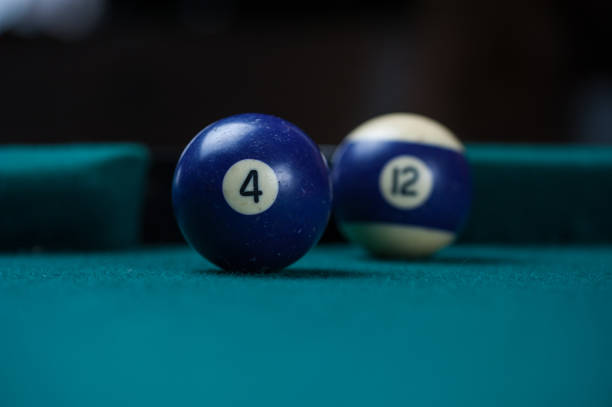 istock Billiards balls and cue on billiards table. Billiard sport concept. 1214429962