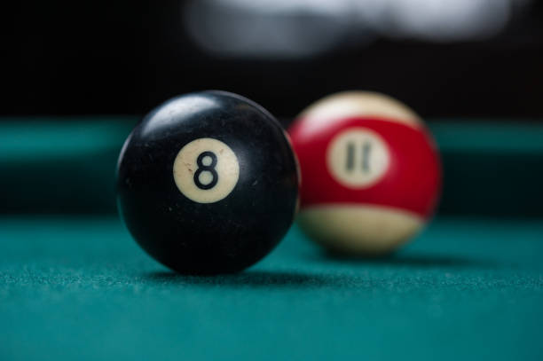 istock Billiards balls and cue on billiards table. Billiard sport concept. 1214430493