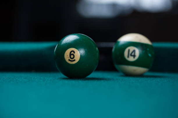 istock Billiards balls and cue on billiards table. Billiard sport concept. 1214431141