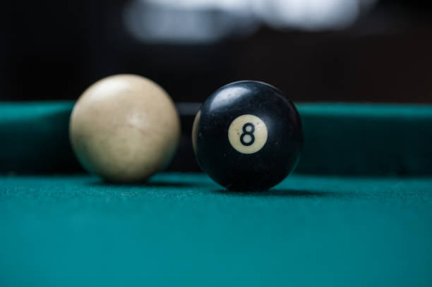 istock Billiards balls and cue on billiards table. Billiard sport concept. 1214431202