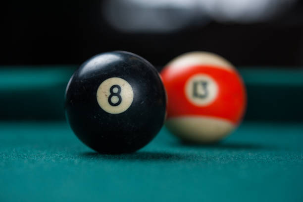 istock Billiards balls and cue on billiards table. Billiard sport concept. 1214431231