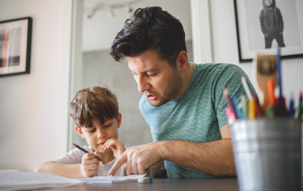 istock Father homeschooling his son 1214431267