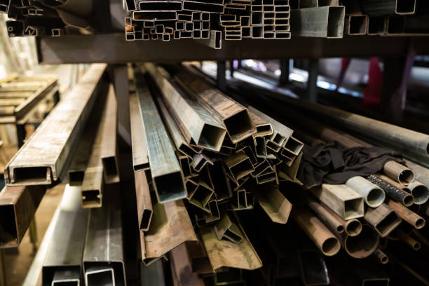 istock Steel structural channels, tubes on shelves 1214431573