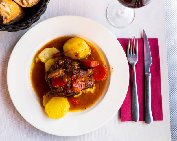 istock Appetizing lamb shoulder baked with potatoes and stewed vegetables 1214431806
