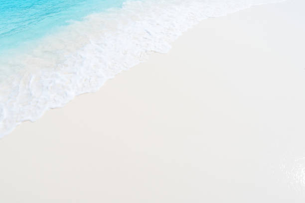Soft wave of clear turquoise sea on sandy beach