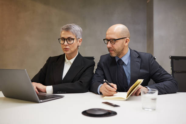 istock Mature Business People Working 1214434051