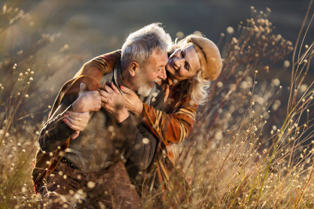 istock Cheerful mature couple having fun in autumn day. 1214434205