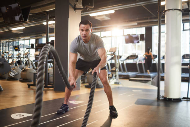 istock Battle Rope Execrcise in Gym 1214435275