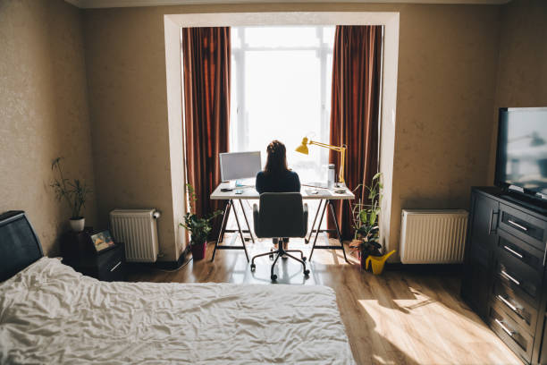 istock woman working on laptop at home. telework 1214437148