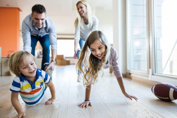 istock Wheelbarrow race at new apartment! 1214437626