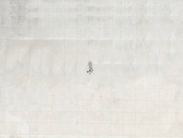 istock Man walking alone to represent Social Distancing for COVID-19 1214437763