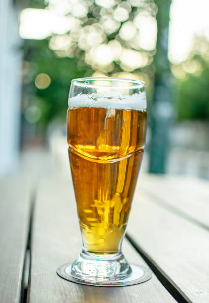 istock A glass of beer on a table.Nice soft background. 1214438622
