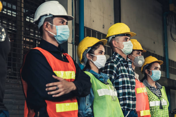 istock Workers with face mask protect from outbreak of Corona Virus Disease 2019. 1214440764