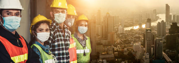 istock Workers with face mask protect from outbreak of Corona Virus Disease 2019. 1214440765