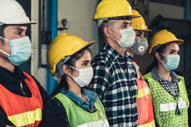 istock Workers with face mask protect from outbreak of Corona Virus Disease 2019. 1214440900