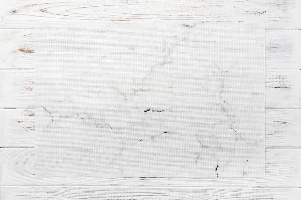 istock Top view of textile white mat for dinner on wooden background with copy space 1214442064