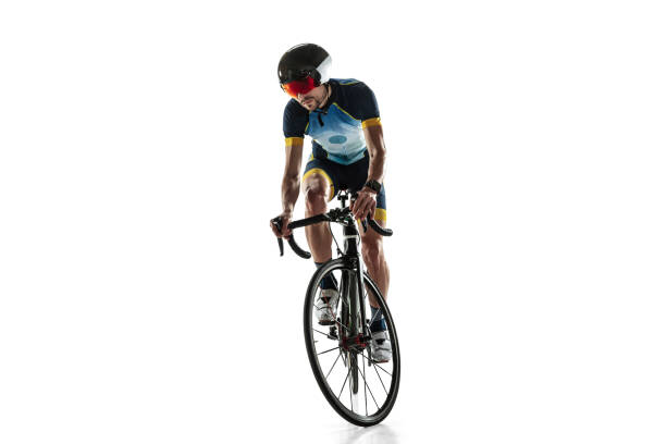 istock Triathlon male athlete cycle training isolated on white studio background 1214442085