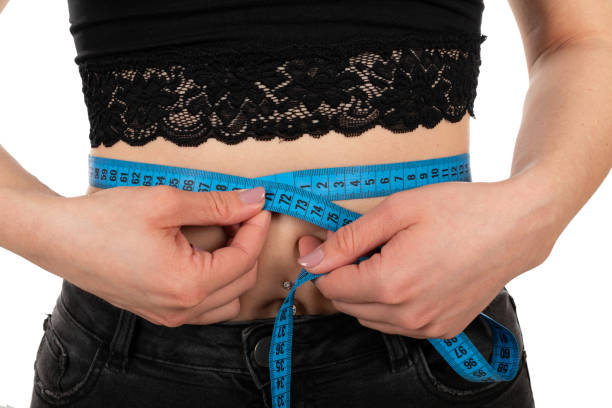 istock Young woman's waistline 1214442139