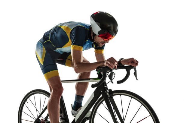 istock Triathlon male athlete cycle training isolated on white studio background 1214442174