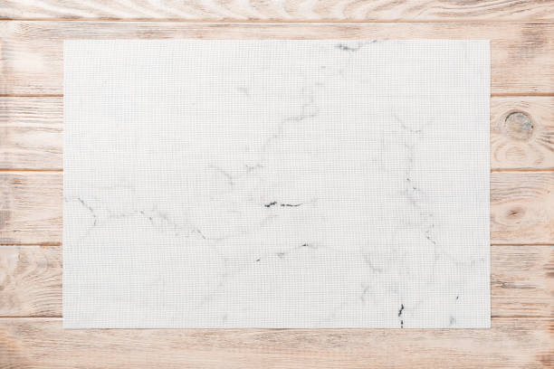 istock Top view of empty white table napkin for dinner on wooden background with copy space 1214442758