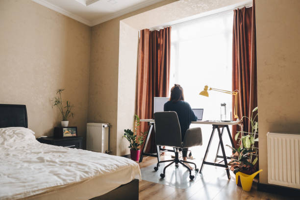 istock woman working on laptop at home. telework 1214443811